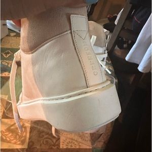 White leather sneakers .